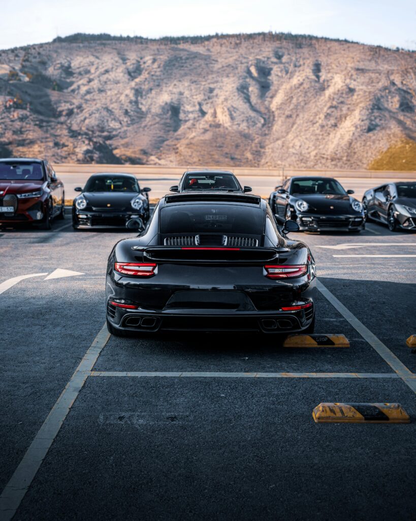 A lineup of luxury cars parked against a mountainous background in Ankara, Türkiye.